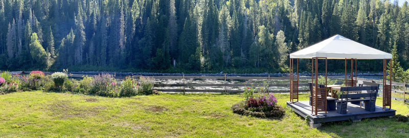 Garden with a gazebo near river. beautiful place for celebrations, altai, russia 