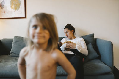 Mother with baby on sofa