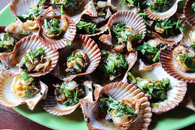 High angle view of shells in plate on table