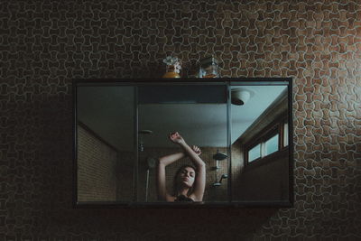 Young woman on tiled floor