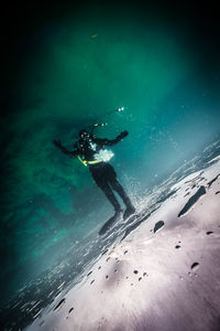 Tilted shot of scuba diver under water