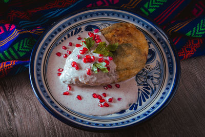 Chile en nogada on a talavera plate from puebla, traditional cuisine of mexico