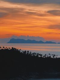 Scenic view of sea against romantic sky at sunset