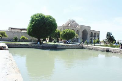 View of river with buildings in background