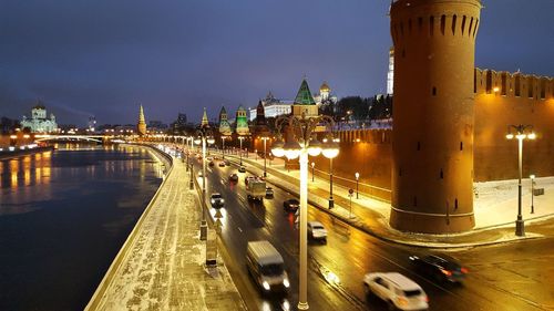Traffic on bridge in city at night