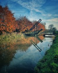 Reflection of trees in lake against sky during autumn