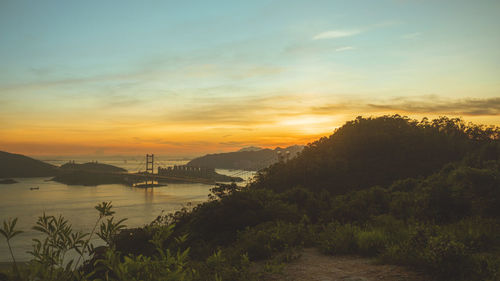 Scenic view of sea at sunset