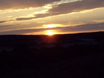 Scenic view of silhouette landscape against sky during sunset