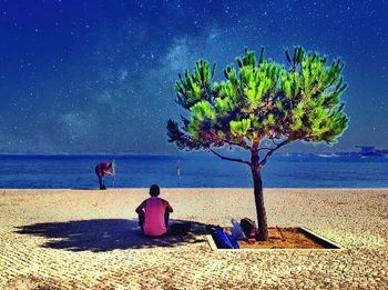 Scenic view of beach against blue sky