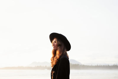 Beautiful, stylish woman on cox bay beach in tofino