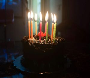 Burning candles on birthday cake