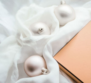 Close-up of wedding rings on paper