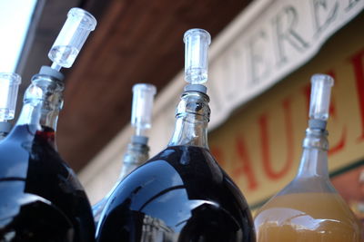 Low angle view of wine bottles