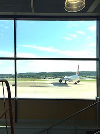 View of airport against cloudy sky