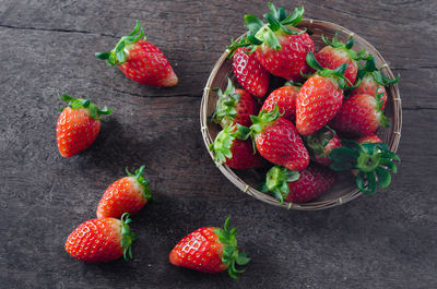 Close-up of strawberries and fruits against black background
