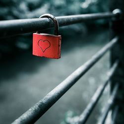 Close-up of padlocks on railing