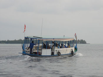 People on boat in sea