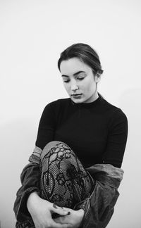 Young woman against white background