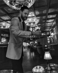 Full length of man standing in restaurant