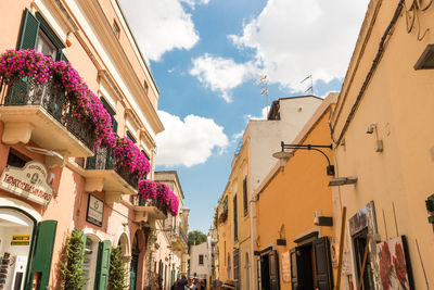 Low angle view of buildings in city against sky