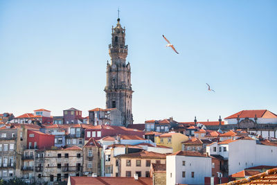 View of buildings in town against sky