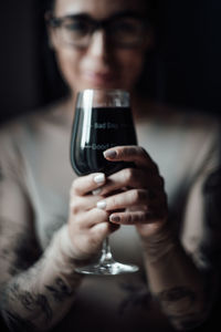 Close-up portrait of a woman drinking glass