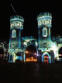 View of illuminated buildings in city at night