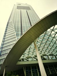 Low angle view of modern office building against sky