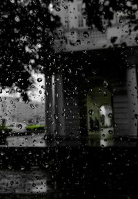 Full frame shot of wet glass window in rainy season