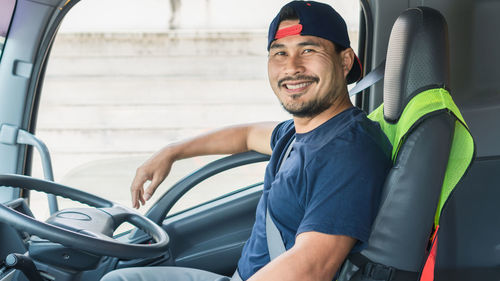 Man sitting in car