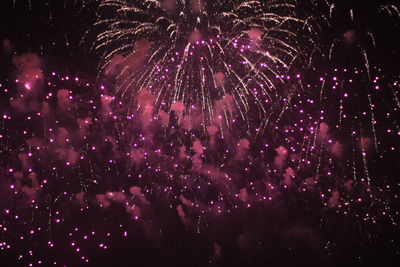 Firework display at night