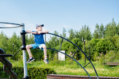 Low angle view of man exercising on field