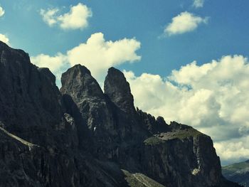 Low angle view of rock formations on landscape against sky