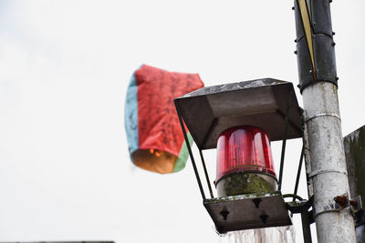 Low angle view of street light against sky