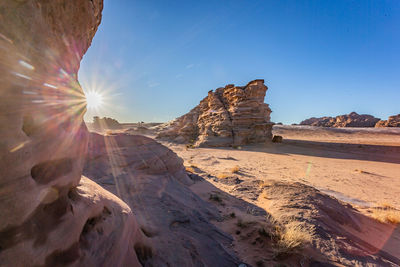 Early morning on a freezing sunrise with ice on the dune