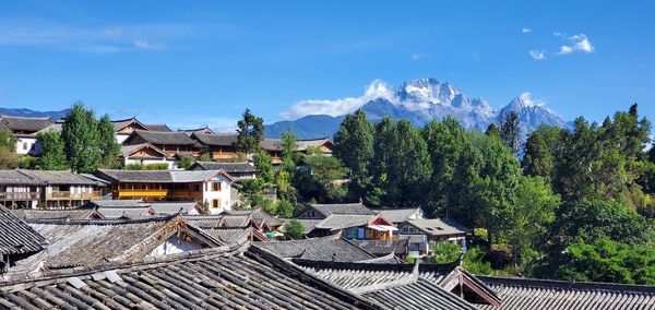 High angle view of townscape against blue sky