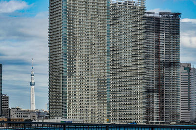 Modern buildings in city against sky