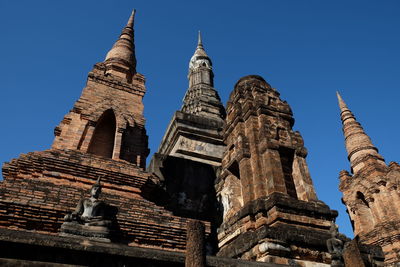 Low angle view of temple against building