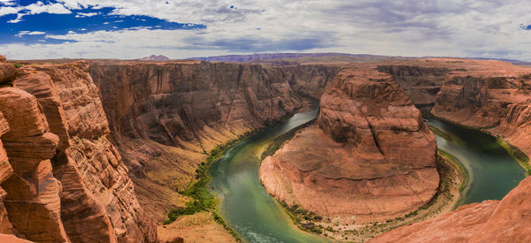 The horseshoe bend near page in the us state of arizona on a summer day with lots of colors
