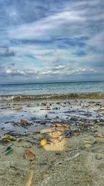 Scenic view of sea against cloudy sky