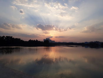 Scenic view of lake against sky during sunset