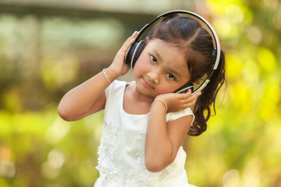 Portrait of cute girl standing outdoors