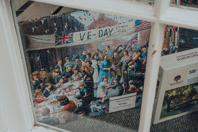 High angle view of people seen through glass window