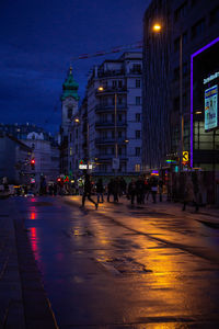 People on city street at night