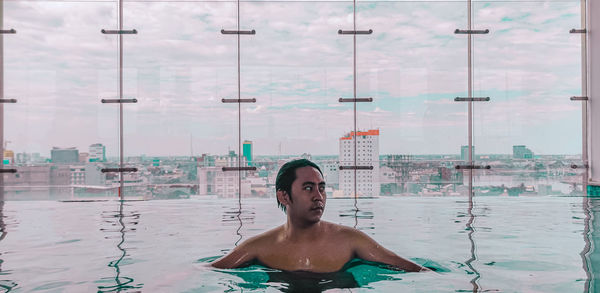 Portrait of pool and city