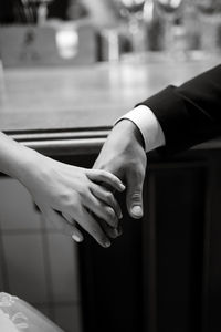 Cropped hand of woman holding hands