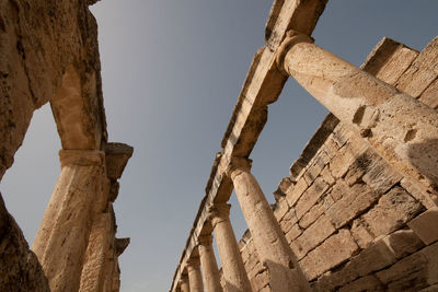 Low angle view of old ruins against sky