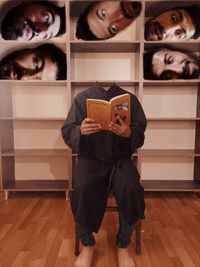 Digital composite image of man holding camera on hardwood floor