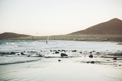 Scenic view of beach against clear sky