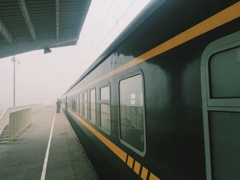 Cropped image of train moving on railroad station platform